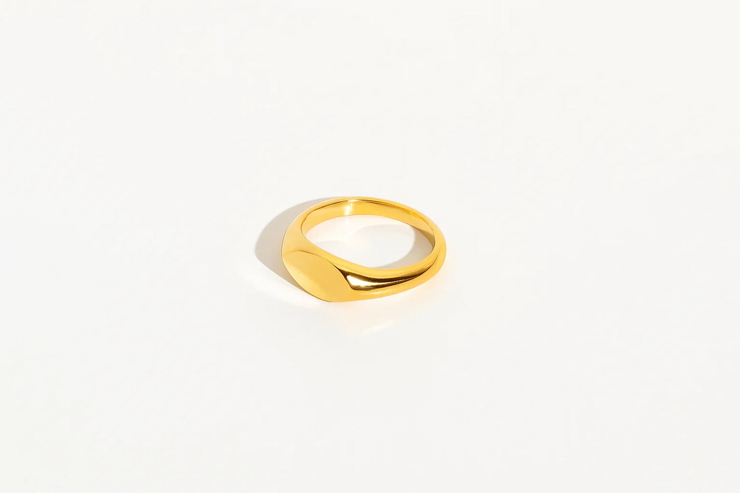 Gold ring on a white background