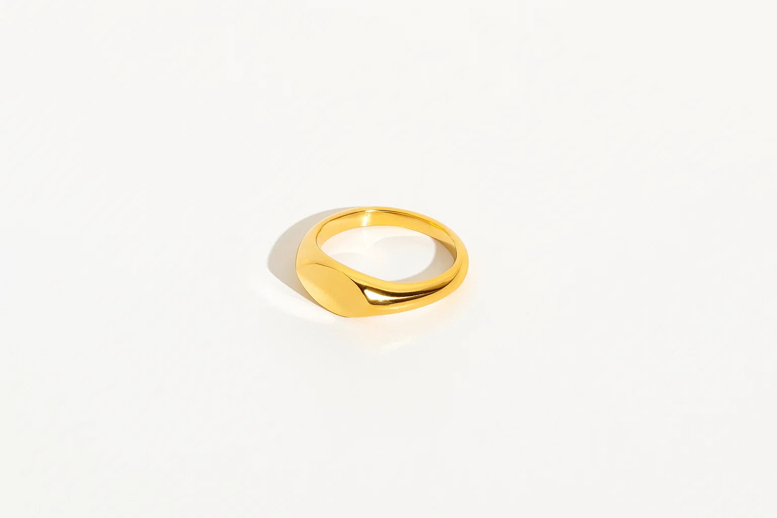 Gold ring on a white background